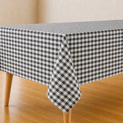 Geruit tafelkleed met blokpatroon op gedekte eettafel
